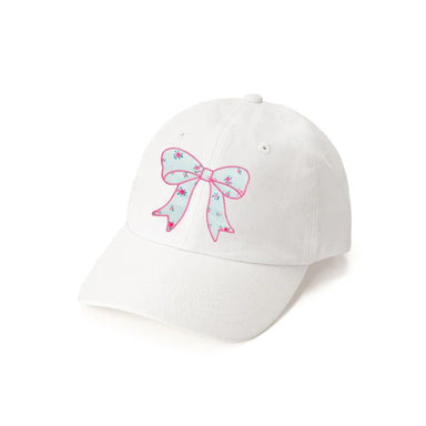 White cap with a pink bow design on a white background