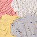 Four children's sweatshirts with different patterns on a checkered background