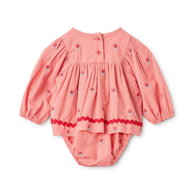 A baby girl's long-sleeve romper in a pink and white gingham check pattern, decorated with small embroidered strawberries and a red wavy hem trim, shown flat on a white background.