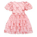 A pink girls' dress with short puff sleeves and a gathered skirt, featuring a repeating shiny bow and diamond lattice pattern.