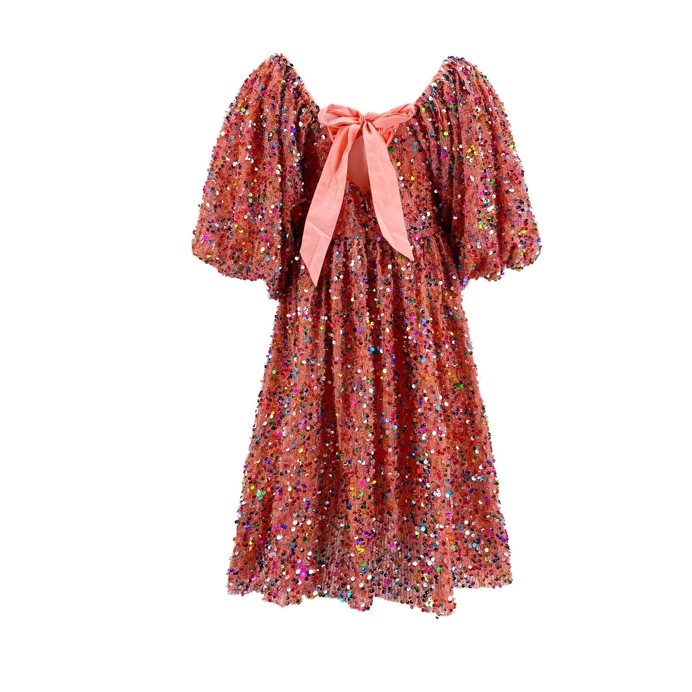 back view of pink puff sleeve dress covered in multicolor sequins and ribbon bow detail