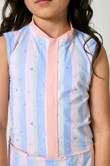 Pastel striped sleeveless top worn by a person against a neutral background