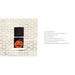 Black bottle with a pumpkin design on a textured white background