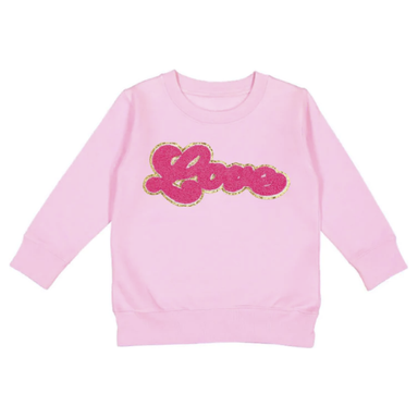 pink crewneck sweatshirt with hot pink chenille letters spelling "Love" outlined in gold