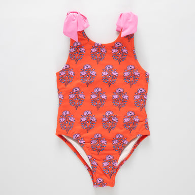 Orange swimsuit with pink floral pattern on a white background
