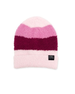 A fuzzy knit beanie hat with horizontal stripes in light pink, medium pink, deep burgundy, and pale pink, featuring a small black brand tag on the front cuff.