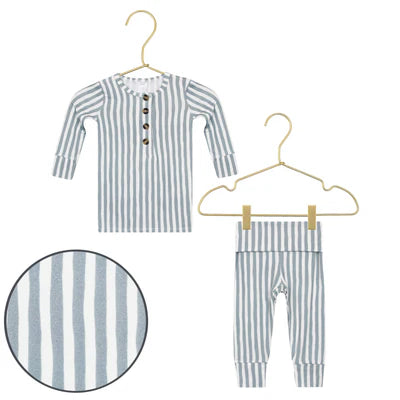 Baby grey striped shirt and pants set on hangers with a close-up of the fabric pattern.