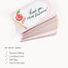 Stack of pink cards with a teacher-themed design on a white background