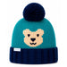 A teal and navy blue knit beanie hat with a dark navy pom-pom on top and a knitted bear face on the front. The bottom cuff is ribbed navy blue, and a small white tag is visible on the side.