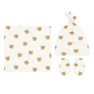 Baby hat and blanket set with bear pattern on a white background