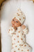 Infant in bear patterned zipper footie