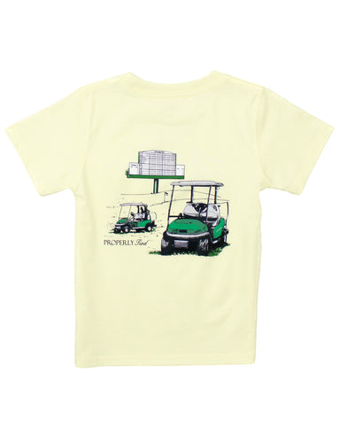 Light yellow t-shirt with a graphic of golf carts and a scoreboard on the back, on a white background.