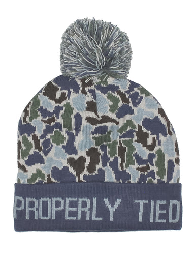 Camouflage patterned beanie with pom-pom and 'Properly Tied' text on a white background