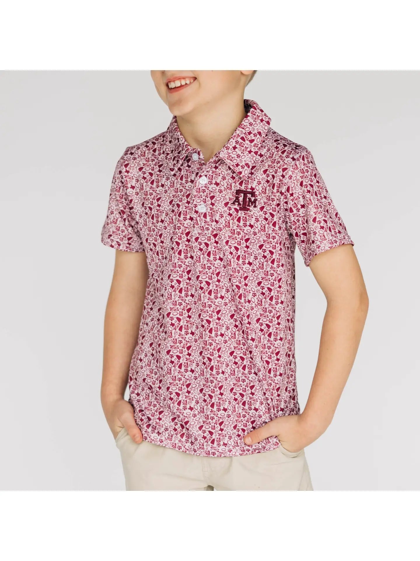 Child wearing a red floral patterned shirt on a white background