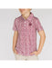 Child wearing a red floral patterned shirt on a white background