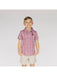 Young boy wearing a patterned shirt and beige shorts on a white background