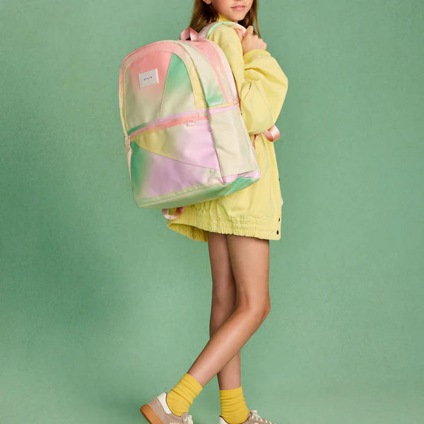 Girl carrying a Tie Dye Kane Double Pocket Backpack