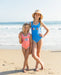 Blue girls swimsuit with Vacay sparkle across the front
