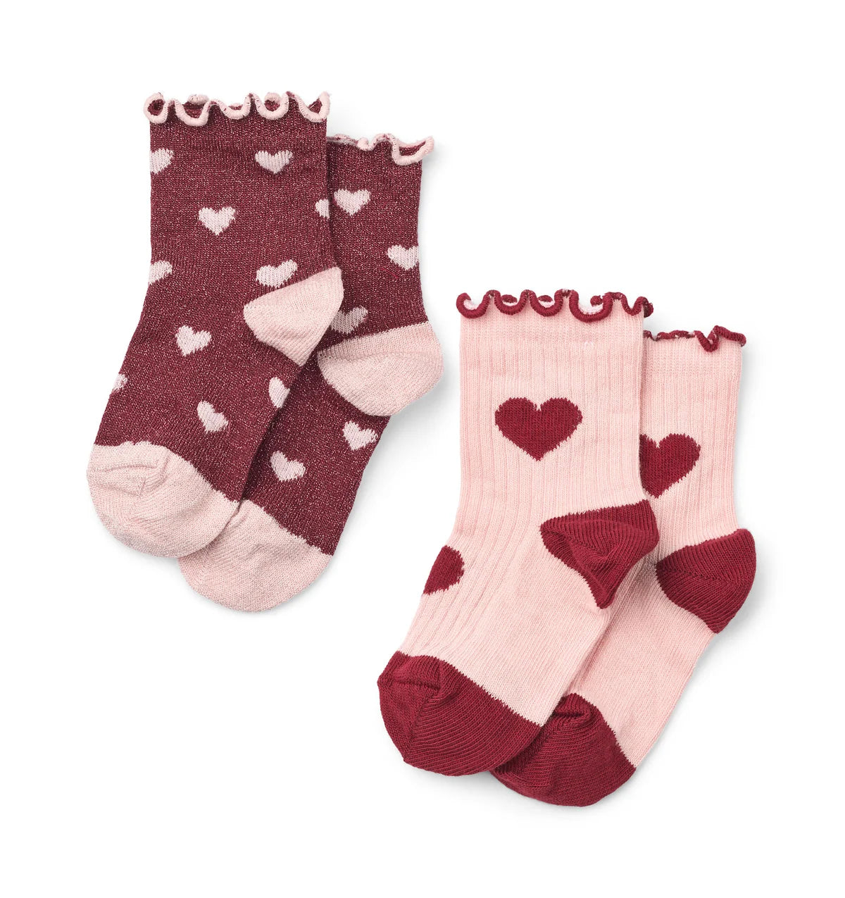 Two pairs of children's socks on a white background. One pair is dark burgundy with small white hearts and a light pink toe and heel, featuring a ruffled cuff.