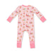 A baby's long-sleeve footless pajama romper in light pink, featuring an all-over print of Santa Claus and reindeer, with solid pink cuffs and leg cuffs.