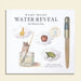 Book titled 'Wishy Washy Water Reveal' with illustrations and a pen on a beige background