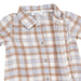 A close-up of a short-sleeve baby shirt by Angel Dear, featuring a brown, white, and light blue gingham plaid pattern with a button-down front.
