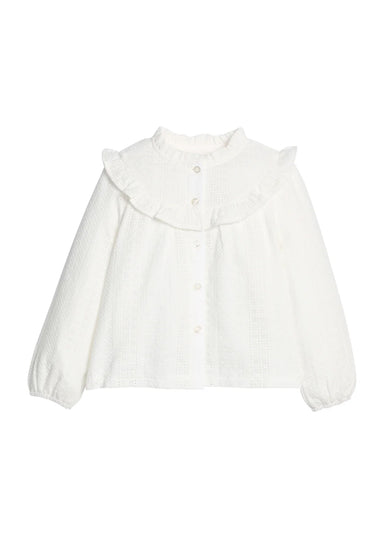 White eyelet blouse on a white background