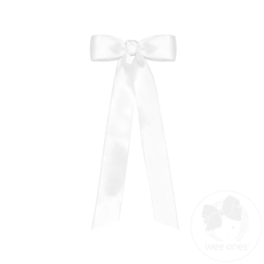White satin ribbon bow on a white background