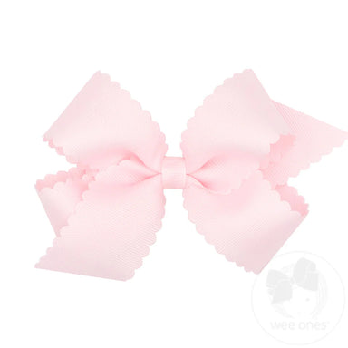 Large pink bow on a white background