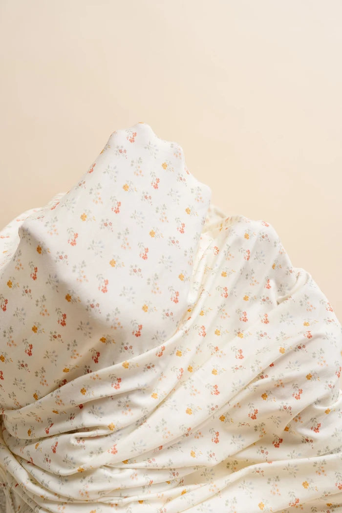 Floral patterned fabric on a beige background