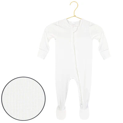 A white long-sleeve baby footed sleeper with a front zipper, hanging on a gold hanger against a white background, with a circular inset showing a close-up of the ribbed fabric texture.