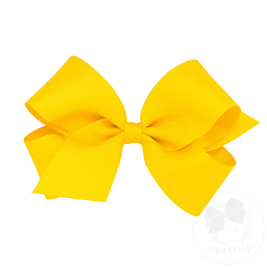 Yellow hair bow on a white background