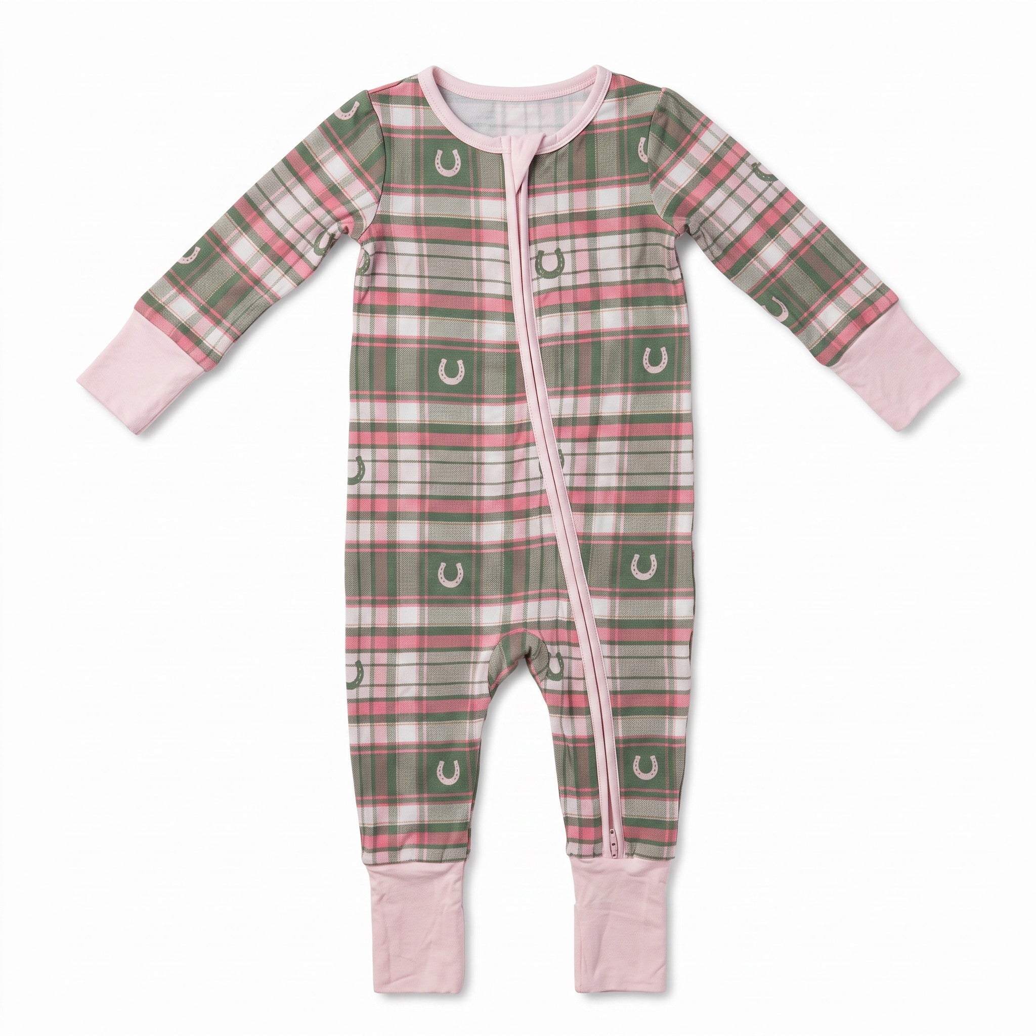 A baby long-sleeve footless sleeper with a green, pink, and white plaid pattern featuring horseshoe motifs, complete with a pink zipper and pink cuffs and leg cuffs, shown on a white background.