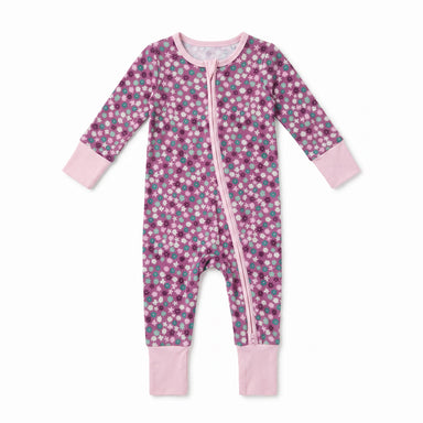 A baby long-sleeve footless one-piece sleeper with a pink, purple, and teal floral pattern, featuring light pink cuffs and a light pink front zipper.