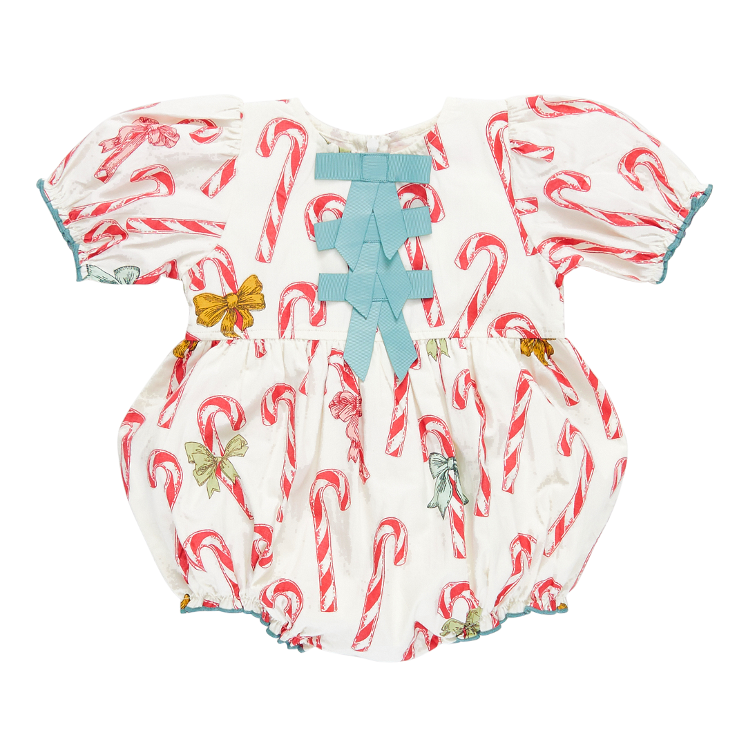 white puff sleeve bubble with red candy cane print and 3 blue bows along the center