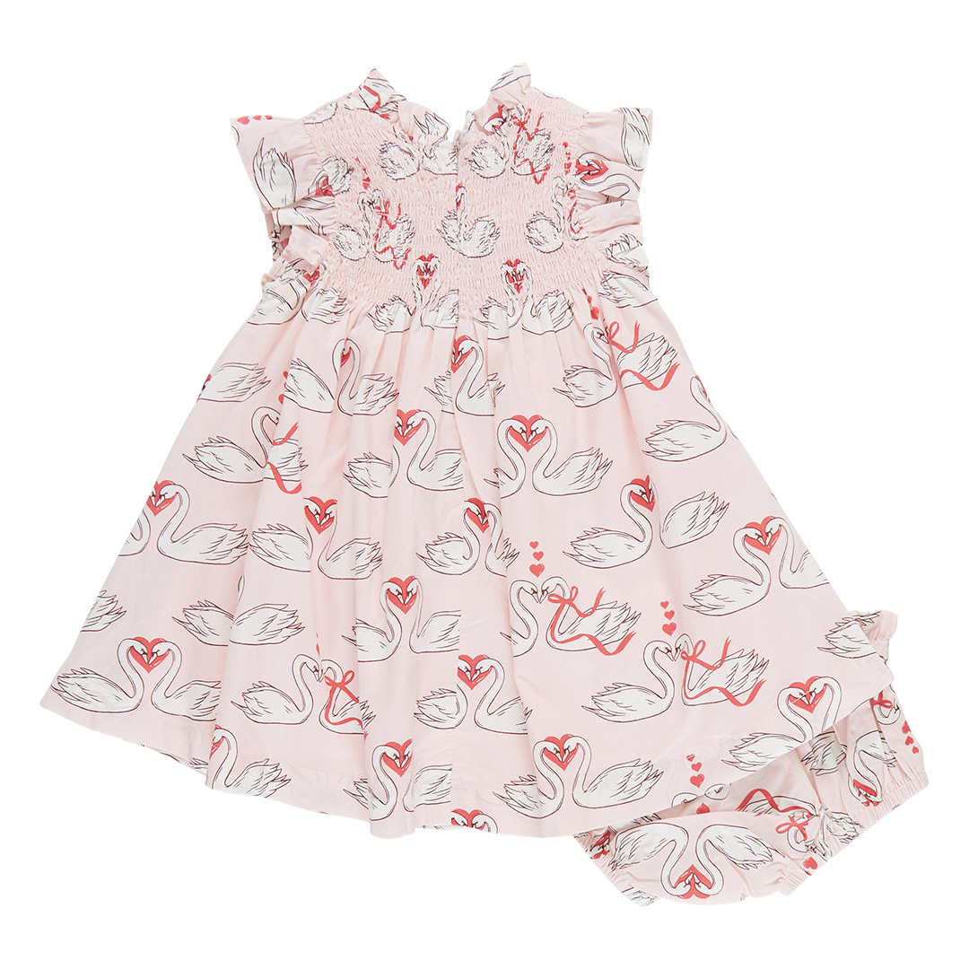 light pink ruffle smocked sleeveless dress with swan and heart print all over with matching bloomers
