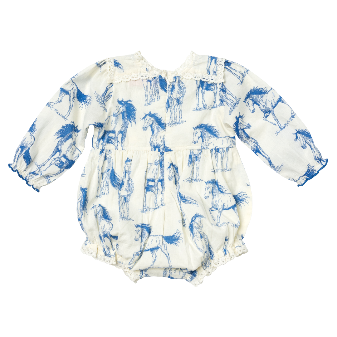 back of cream colored long sleeve bubble with blue horse print