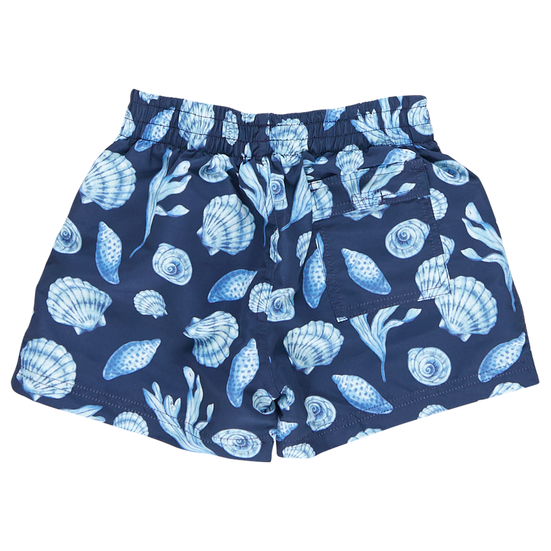 back of navy blue swim trunks with light blue seashell print