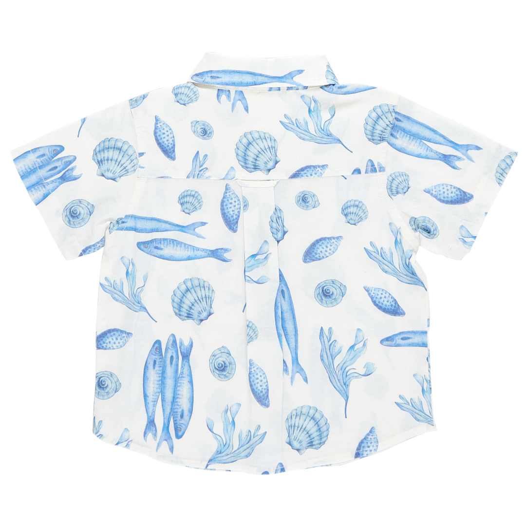 back of white short sleeve collared button down with blue seashell and fish print