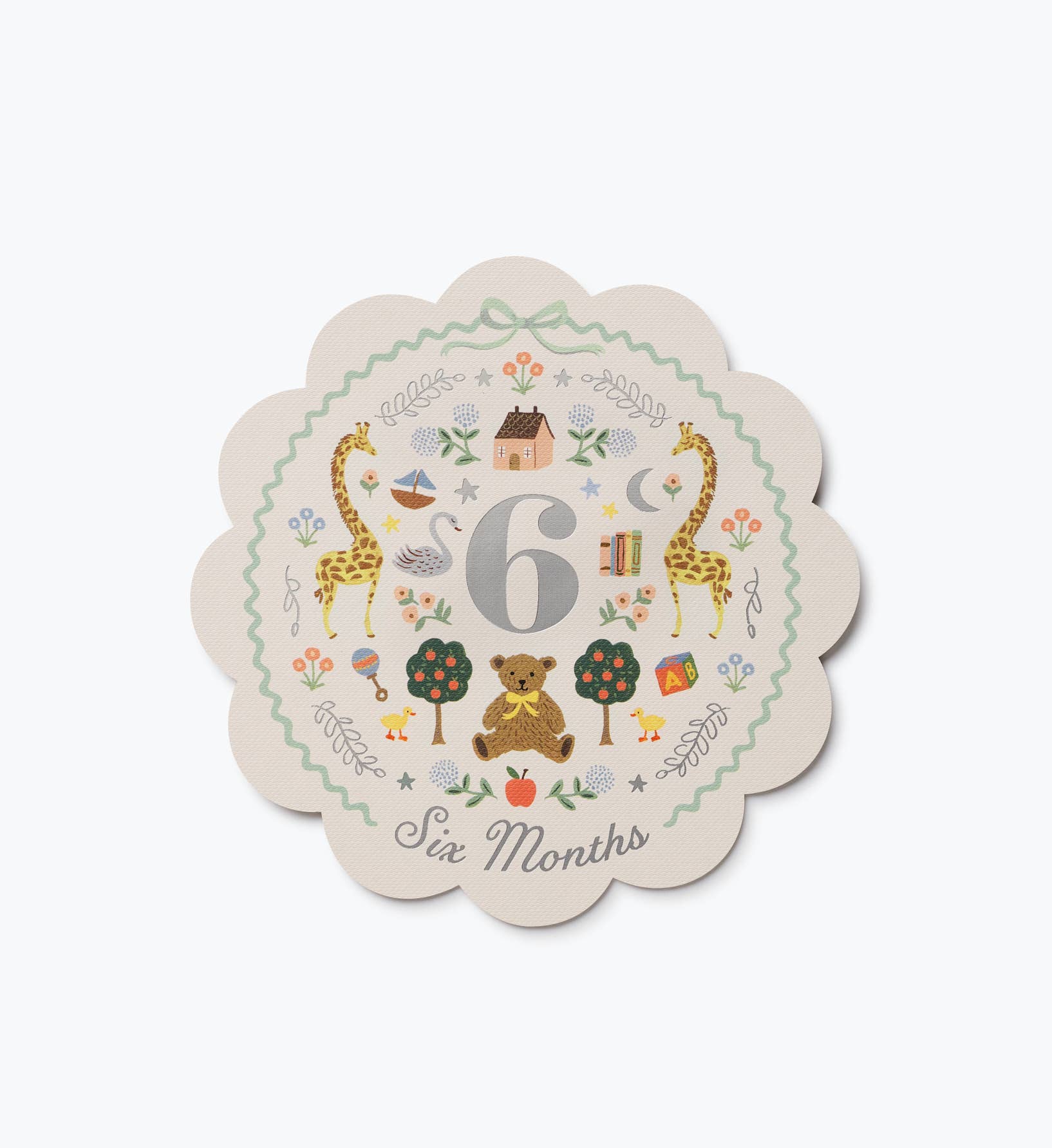 Illustrated six month baby milestone card with a large number 6 and Six Months lettering surrounded by woodland animals flowers and playful details by Rifle Paper Co.