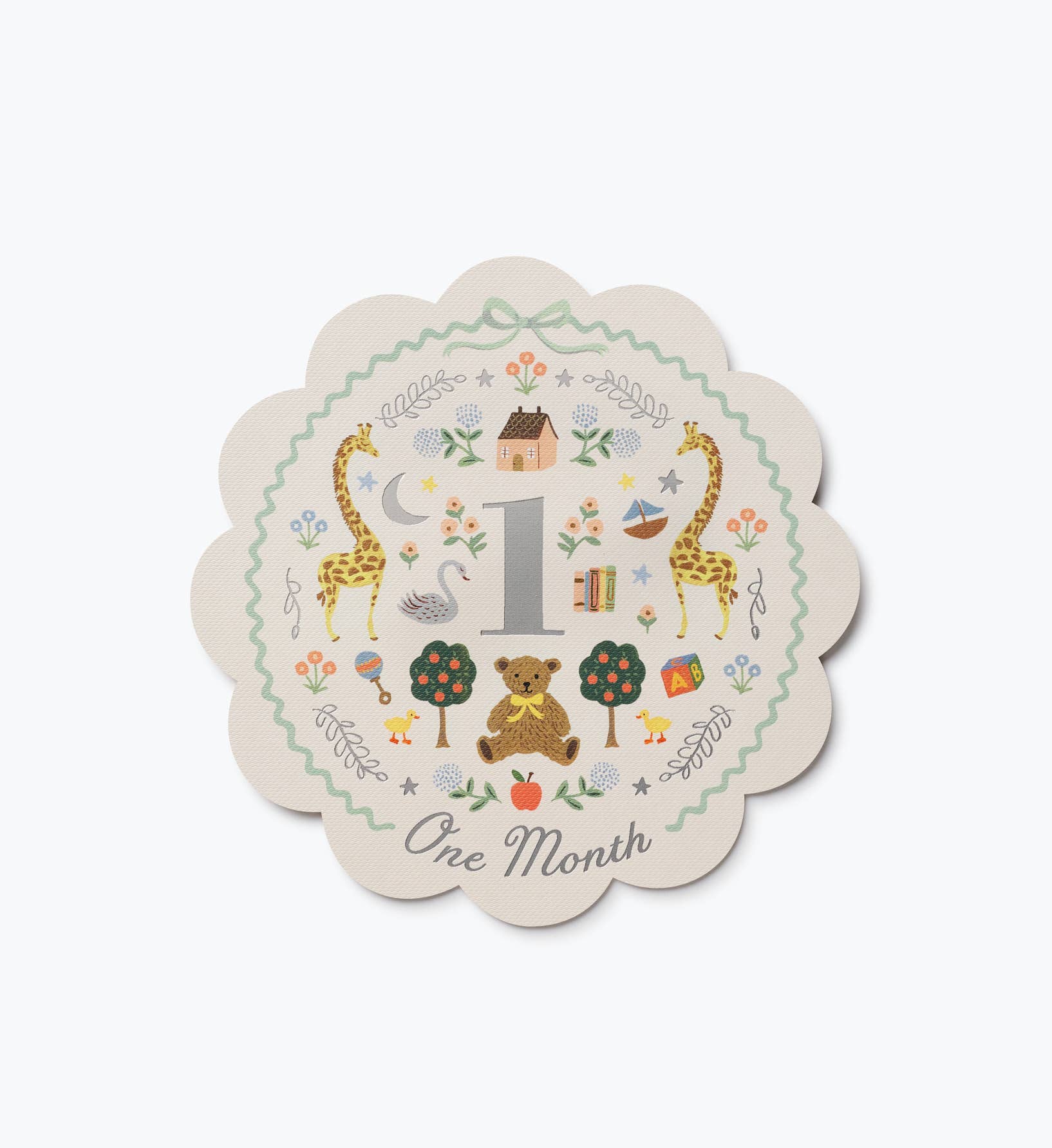 Rifle Paper Co illustrated baby milestone card for one month featuring a large number one giraffes animals flowers and decorative scalloped edges