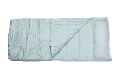 Folded light blue blanket on a white background