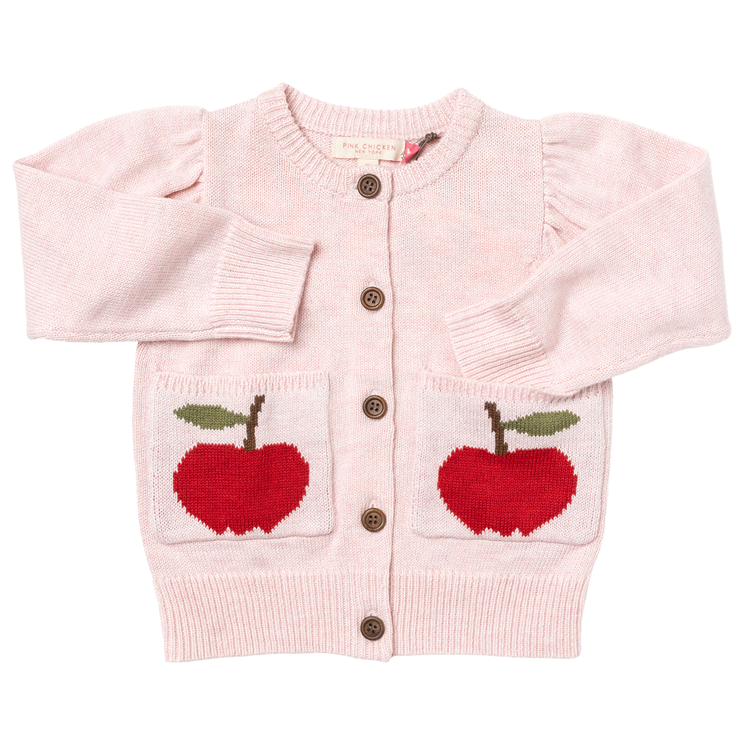 light pink cardigan with knit apples on the pockets