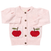 light pink cardigan with knit apples on the pockets