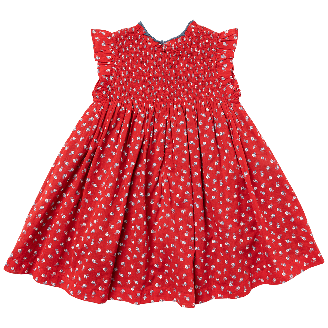 back of red sleeveless dress with smocking at the chest and tiny white rose print