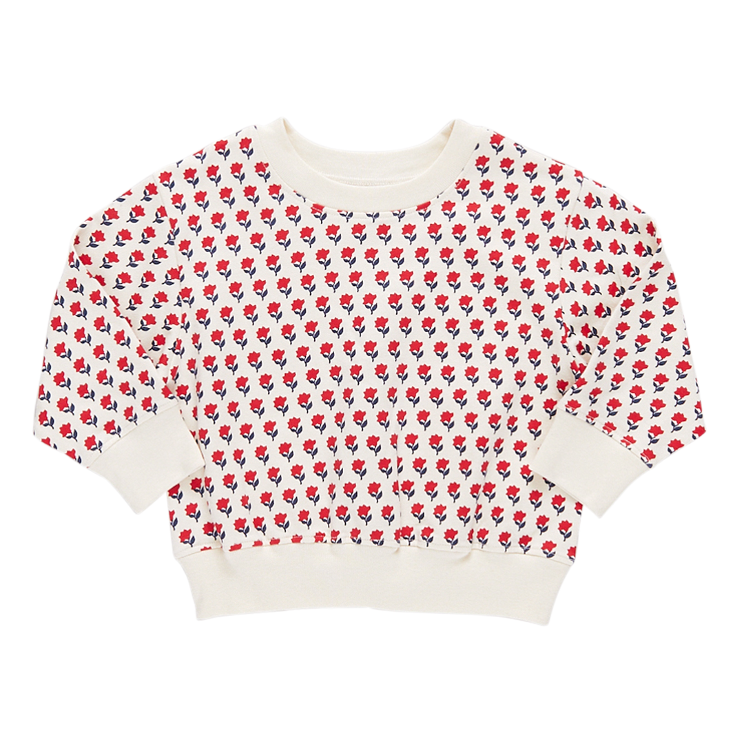 cream colored crew neck sweatshirt with red and navy tiny floral print