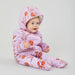 baby girl sitting up wearing lavender purple snowsuit with orange poppy flowers and fleece lining