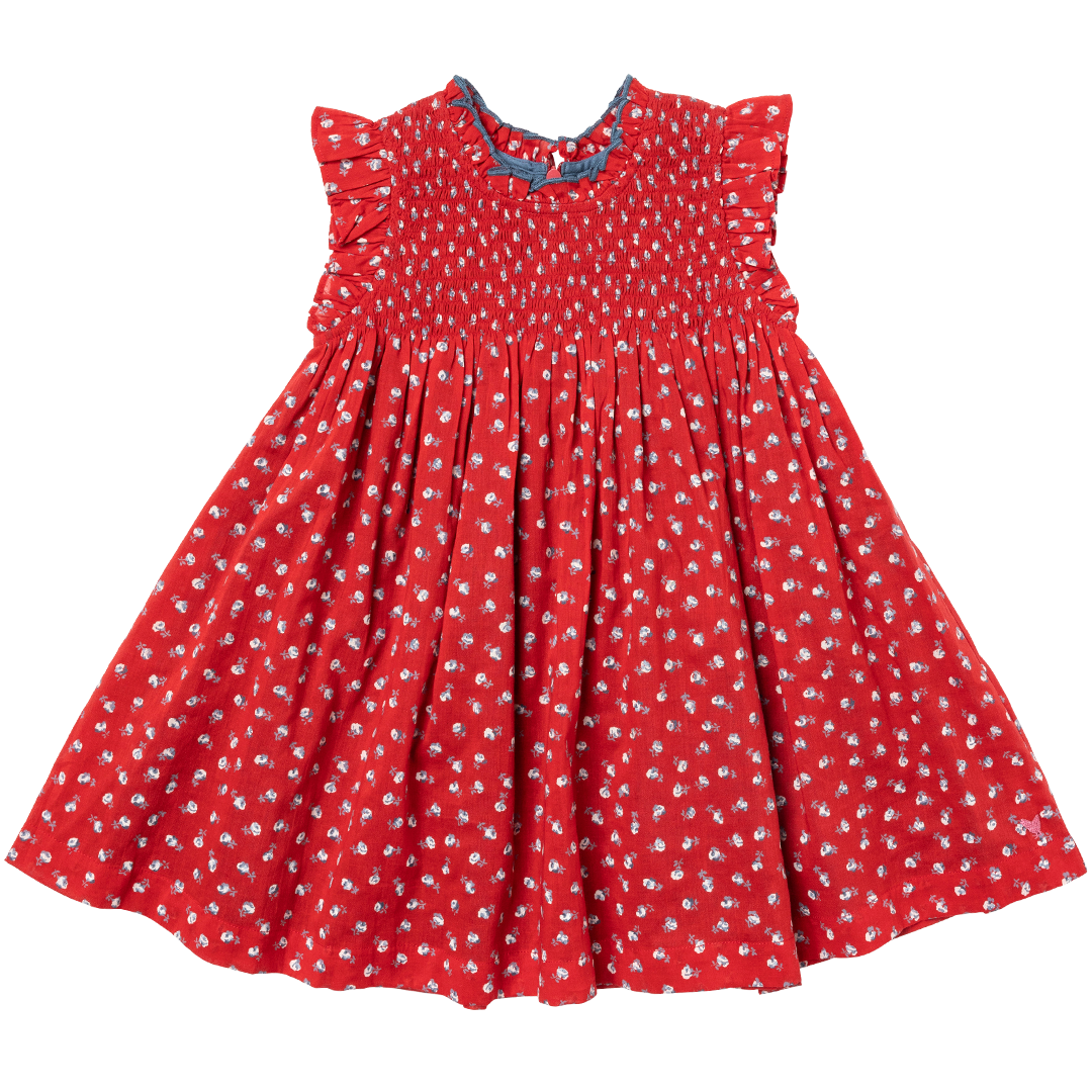 red sleeveless dress with smocking at the chest and tiny white rose print