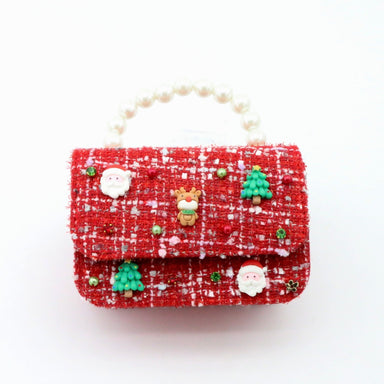 Red textured handbag with Christmas-themed decorations on a white background
